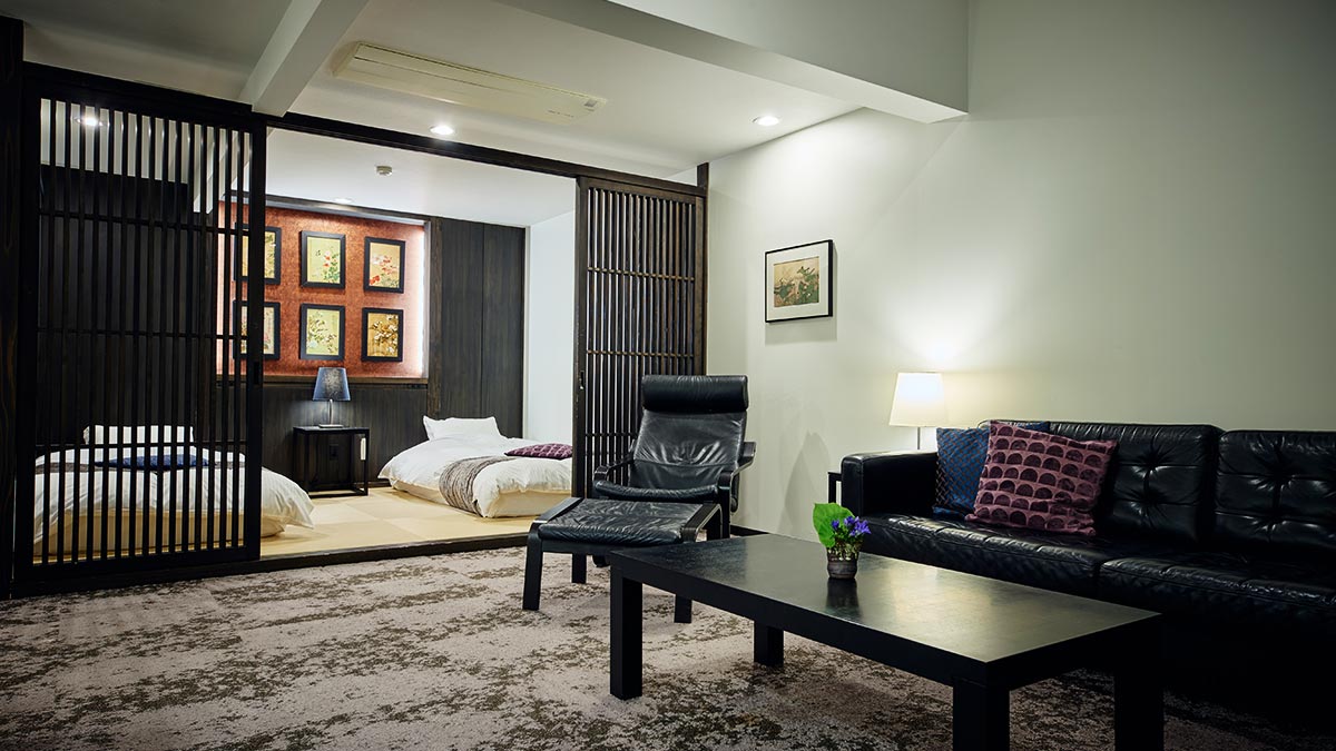 Suzuran suite twin bedroom and living area at Minakami Sansou